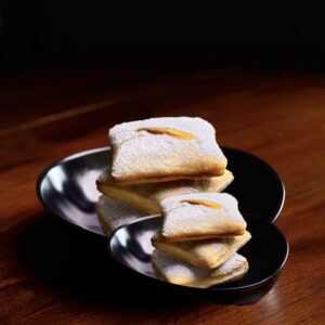 Fresh handmade beignets with powdered sugar from Cajun Flare in Reseda