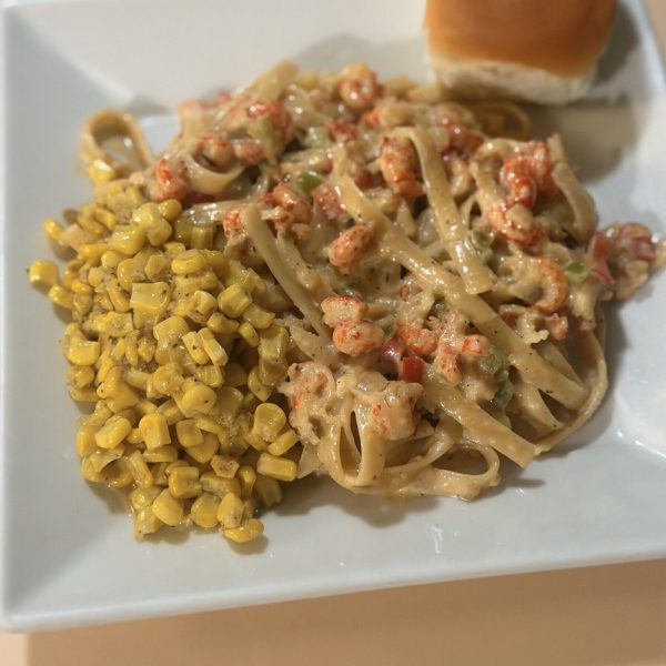 Crawfish Fettuccine Plate Lunch served with side of corn and a roll